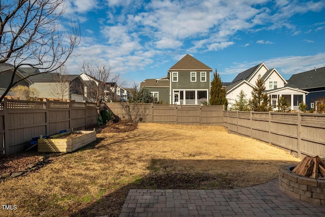 view of yard with an outdoor fire pit and a patio area