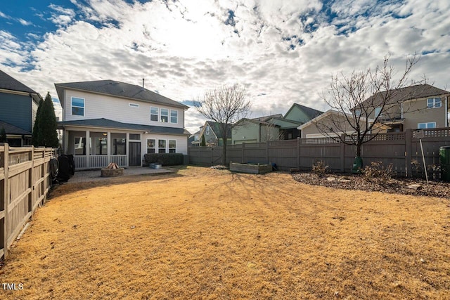 back of property featuring a sunroom