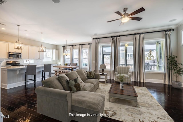 living room featuring dark hardwood / wood-style floors, sink, and ceiling fan