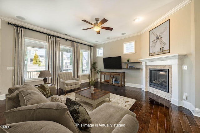 living room featuring crown molding, dark wood-type flooring, and ceiling fan