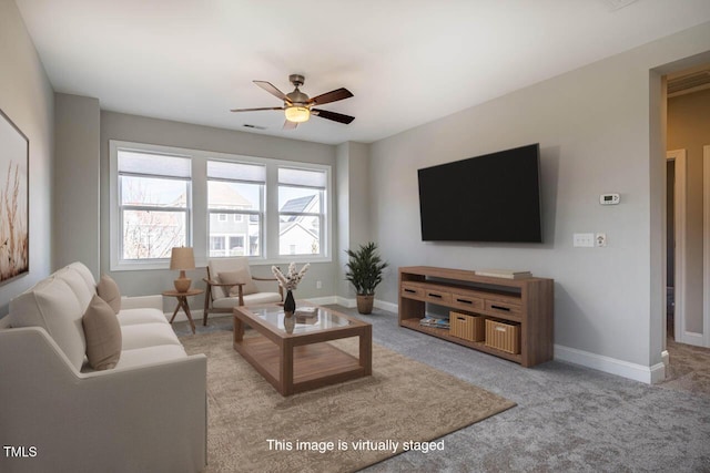 living room featuring light colored carpet and ceiling fan