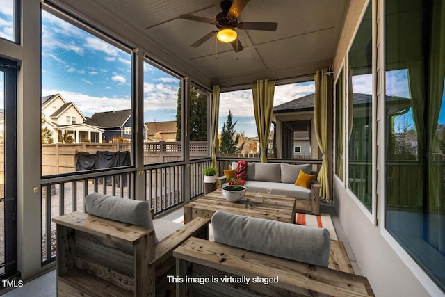 sunroom with ceiling fan