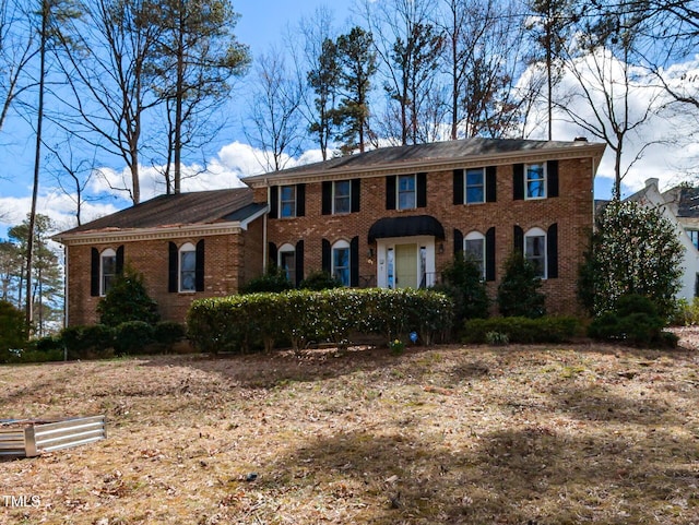 view of front of house featuring brick siding