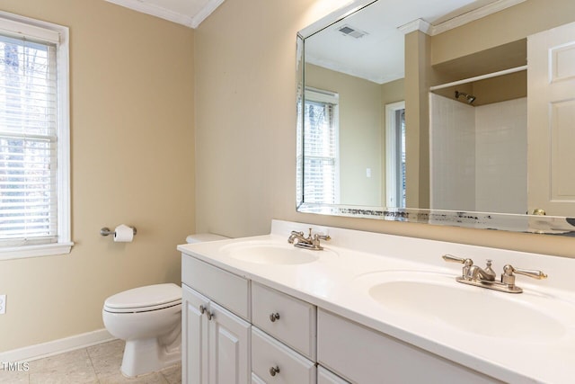 bathroom featuring tile patterned flooring, visible vents, a wealth of natural light, and a sink