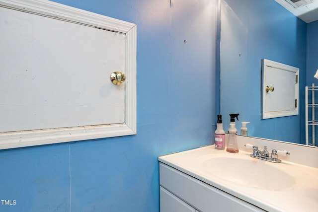 bathroom with visible vents and vanity