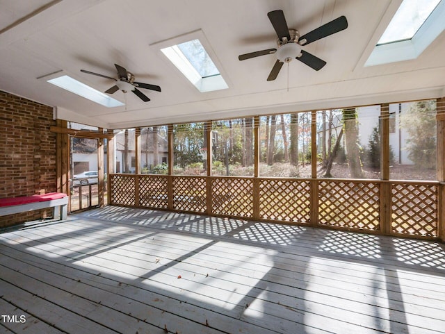 unfurnished sunroom with lofted ceiling and a ceiling fan