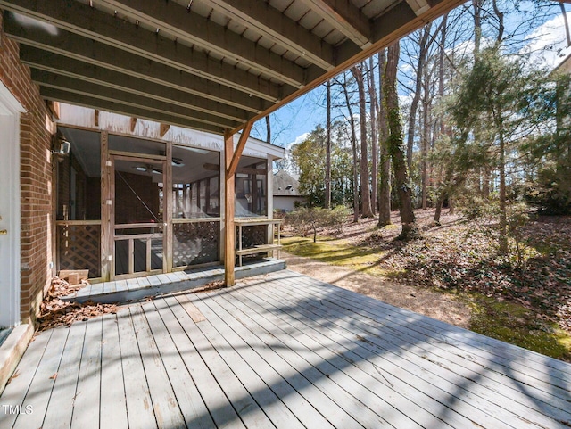 deck with a sunroom