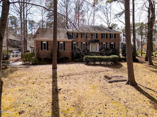 view of front of house featuring brick siding