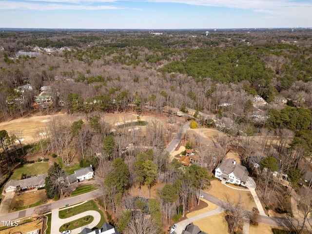 drone / aerial view with a view of trees