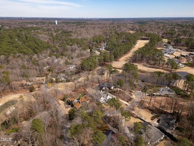 drone / aerial view featuring a view of trees