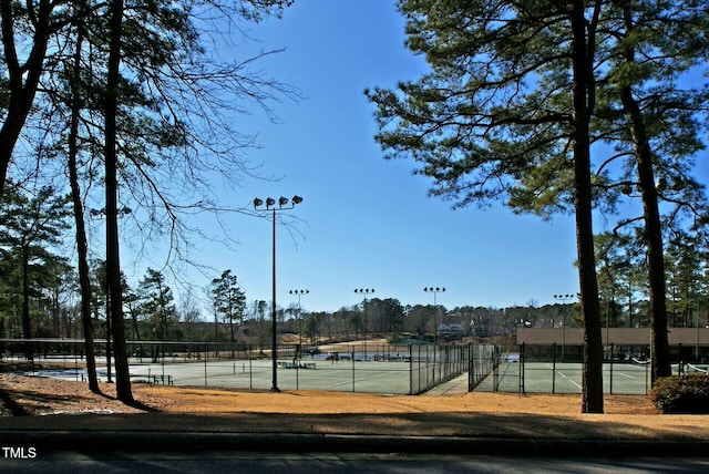 view of sport court with fence