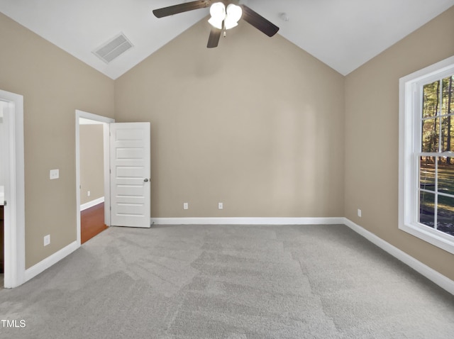 unfurnished bedroom with lofted ceiling, light colored carpet, and ceiling fan