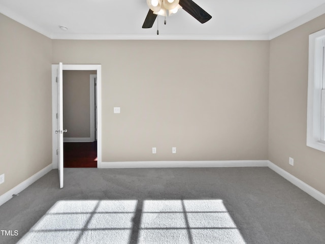 unfurnished room with ceiling fan and carpet