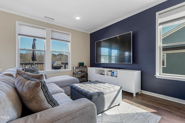 living room featuring crown molding and hardwood / wood-style flooring