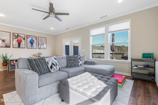 living room featuring ceiling fan, hardwood / wood-style floors, and crown molding