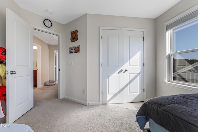 carpeted bedroom with a closet