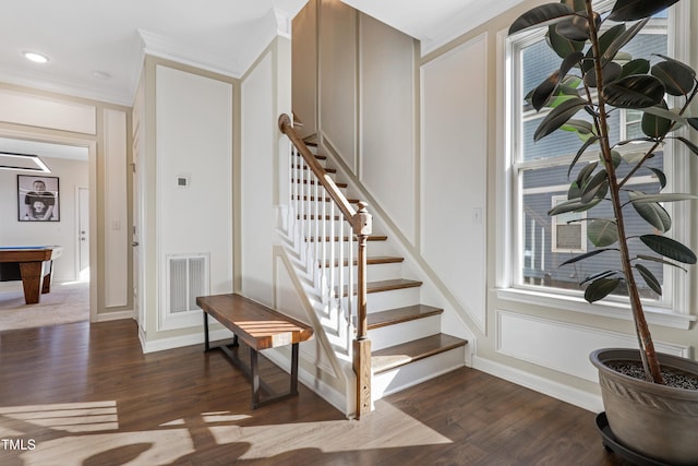 stairway featuring hardwood / wood-style flooring and ornamental molding