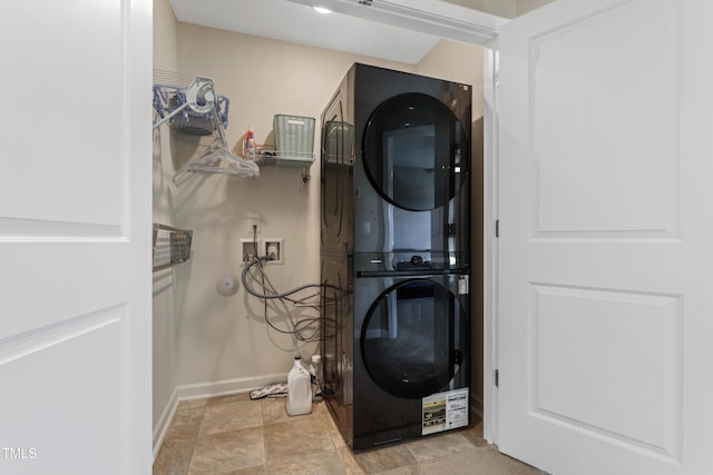 laundry room featuring stacked washer and clothes dryer