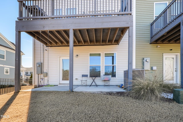 back of house with a patio