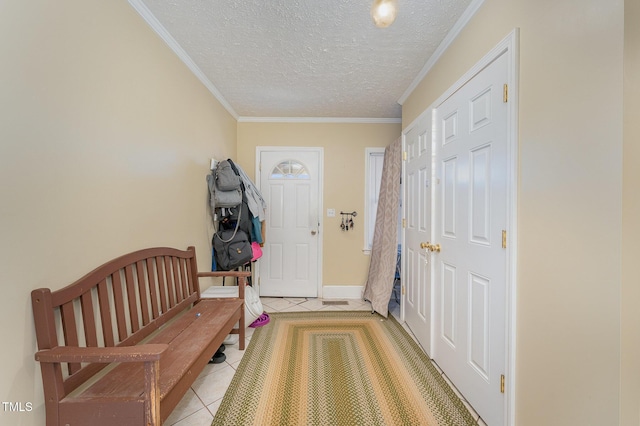 mudroom featuring light tile patterned flooring, a textured ceiling, and ornamental molding