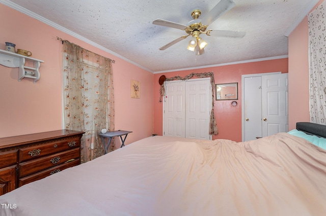 bedroom featuring a textured ceiling, ceiling fan, and crown molding