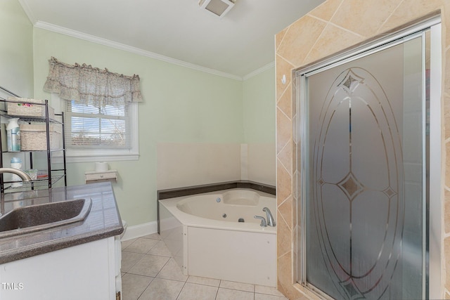 bathroom with ornamental molding, a tub to relax in, vanity, and tile patterned floors