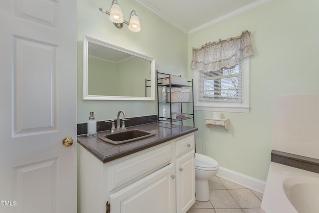 bathroom with ornamental molding, vanity, tile patterned floors, and toilet