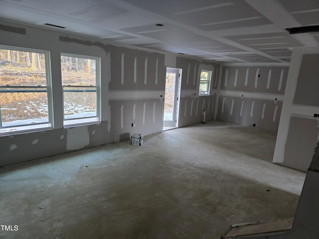 interior space featuring concrete flooring and plenty of natural light