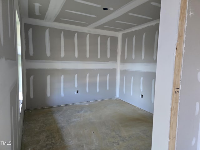 unfurnished room featuring concrete floors