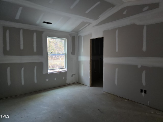 spare room with vaulted ceiling