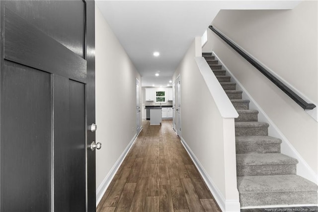 hallway featuring wood-type flooring