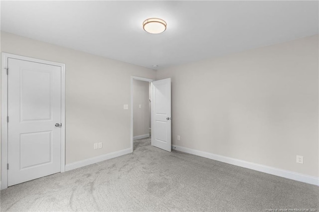 spare room with light carpet