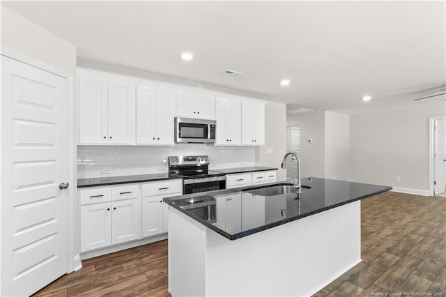 kitchen featuring sink, a center island with sink, white cabinetry, and appliances with stainless steel finishes