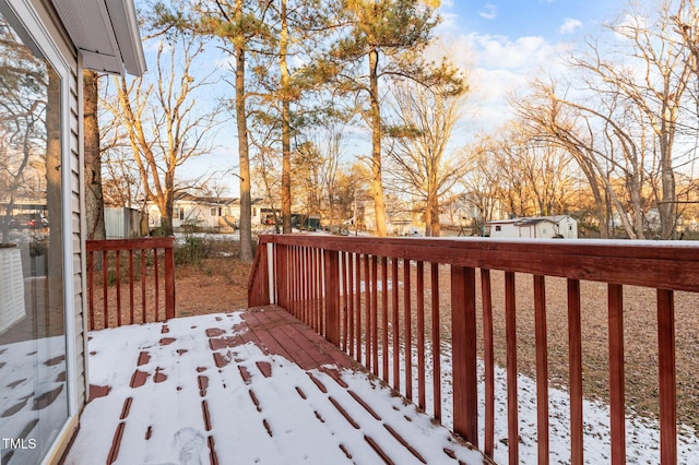 view of snow covered deck