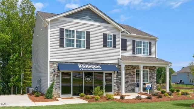 craftsman-style home featuring a front yard