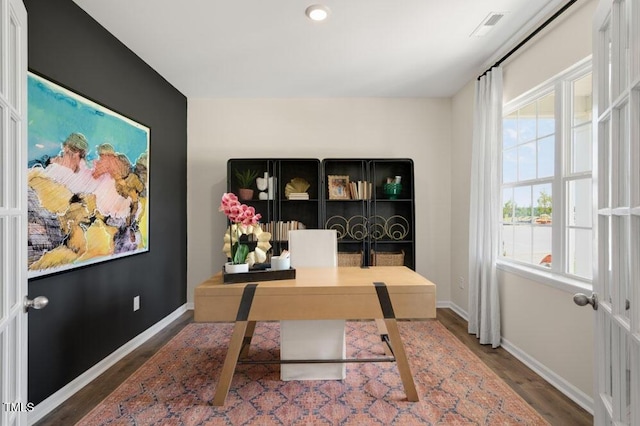 home office featuring dark hardwood / wood-style floors and plenty of natural light