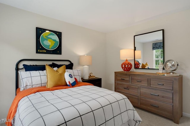 bedroom featuring light carpet