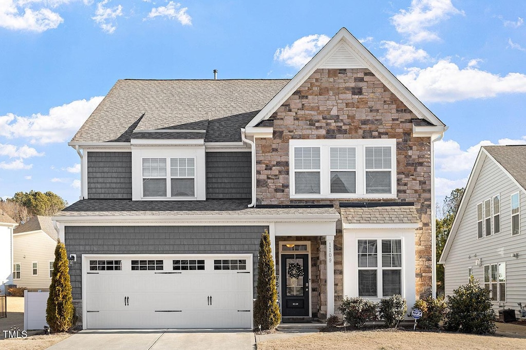 1109 Timbercut Dr, Durham, NC 27703 - front facade with a garage