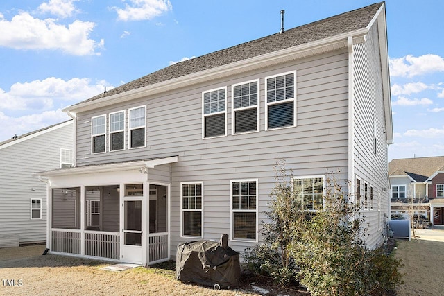 back of house with a sunroom