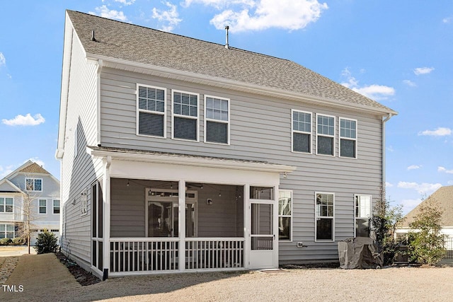 view of front of house with ceiling fan and a sunroom