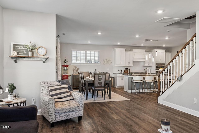 living room featuring dark hardwood / wood-style flooring