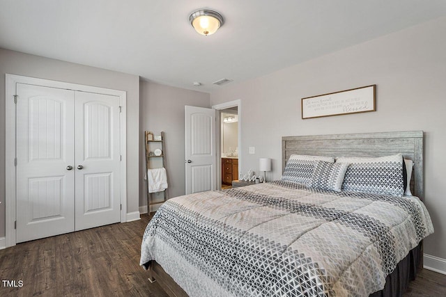 bedroom featuring a closet and dark hardwood / wood-style floors