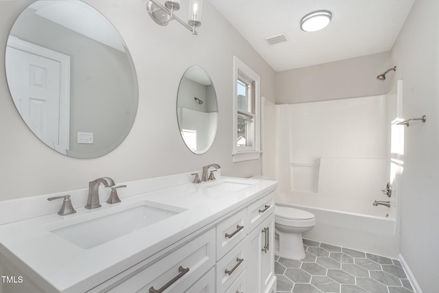 full bathroom featuring toilet, tile patterned floors, vanity, a textured ceiling, and shower / bathtub combination