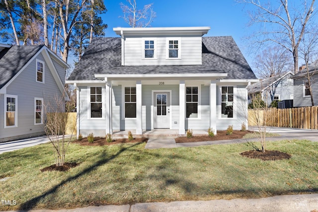 view of front of home featuring a front yard and covered porch