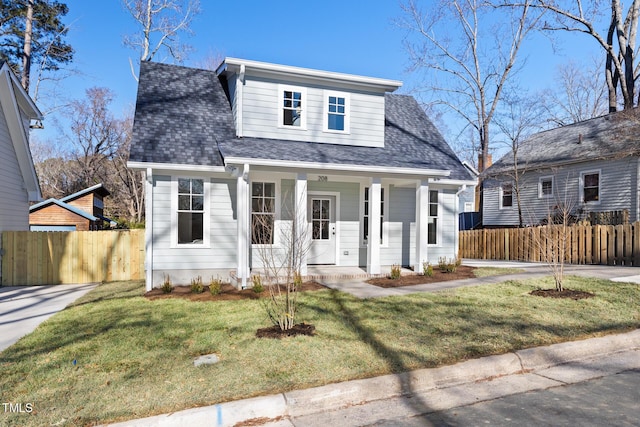 bungalow-style home with covered porch and a front lawn