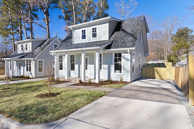 view of front of house with a porch and a front yard