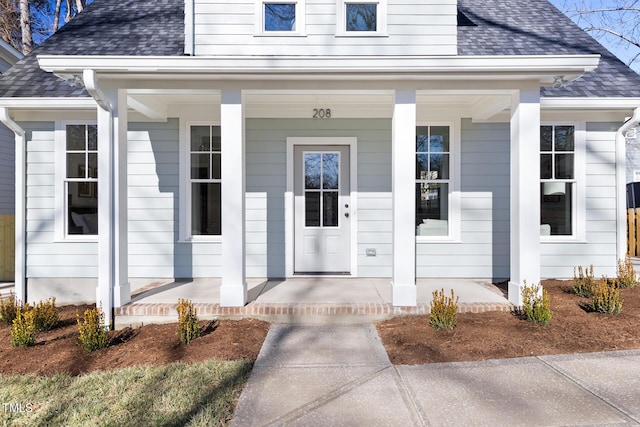 view of exterior entry featuring a porch