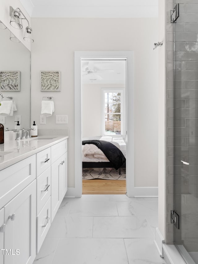 bathroom with ceiling fan, an enclosed shower, and vanity