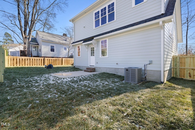 back of house with a yard and cooling unit