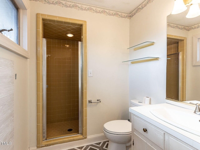 bathroom featuring toilet, walk in shower, and vanity